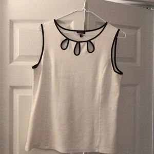 A cotton blend white piped in black top